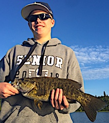Cole with a Trophy Smallmouth Bass Fishing at Fireside Lodge in Canada